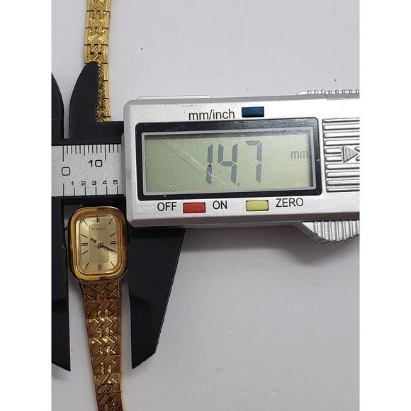 Women\'s Timex watch. Small Gold face with bracelet style band. main image 7